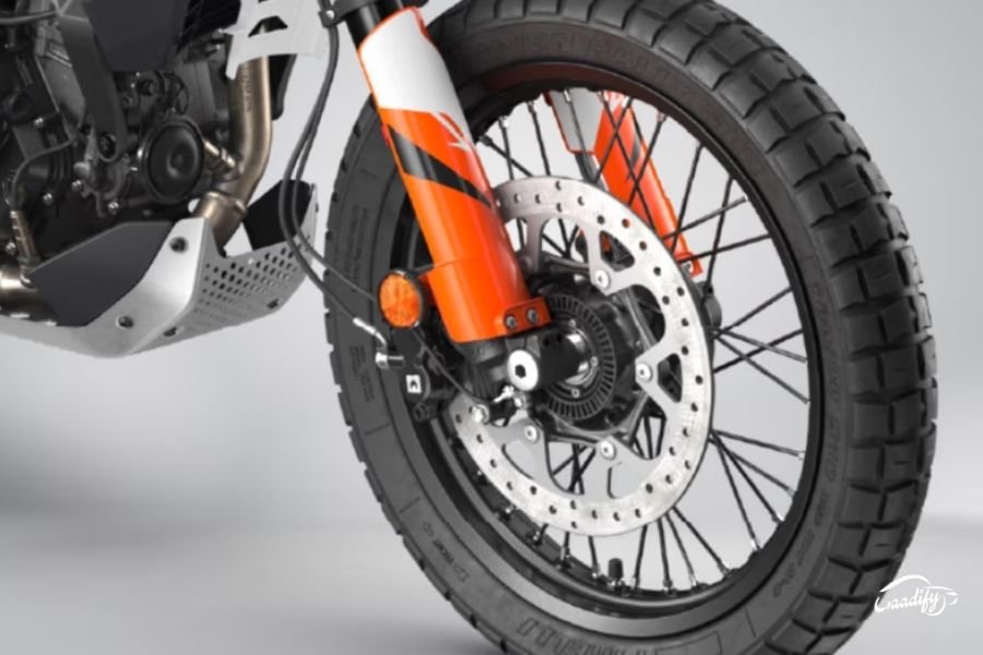 Why is the KTM 390 Adventure R cheaper than the standard model?